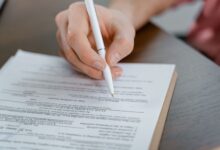 Residential property title documents spread across a desk at a title agency office