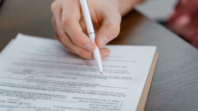 Residential property title documents spread across a desk at a title agency office