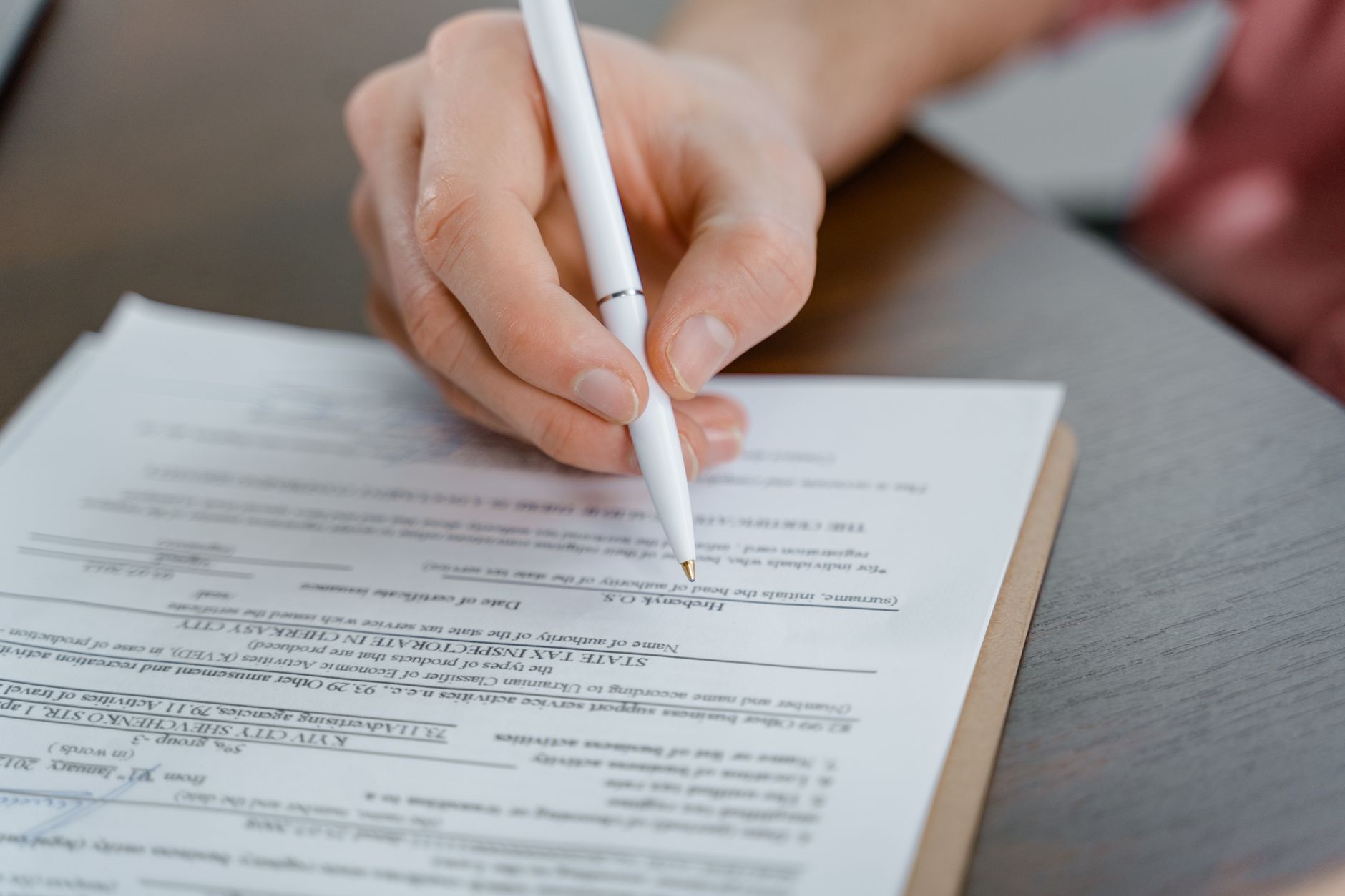 Residential property title documents spread across a desk at a title agency office