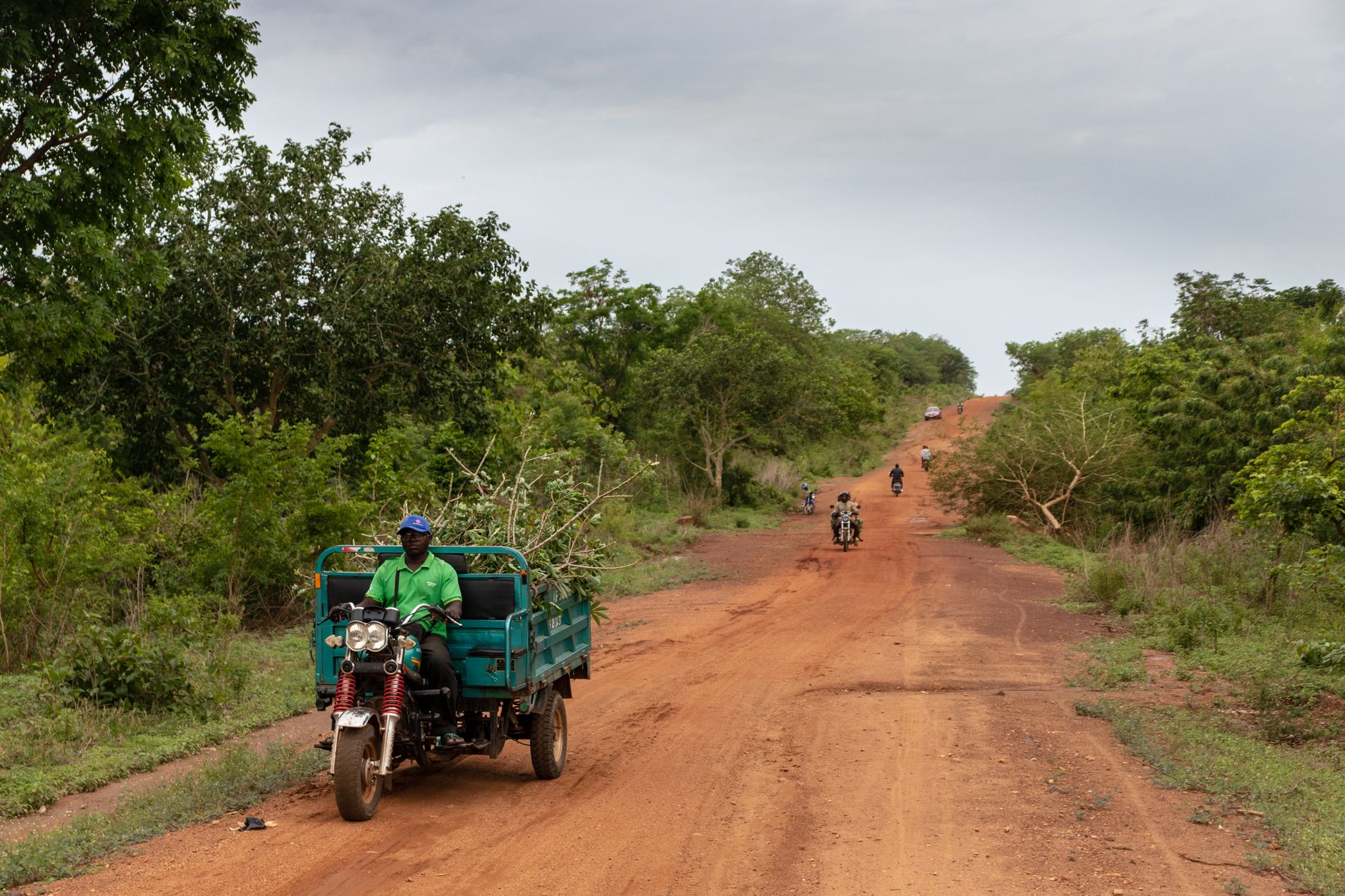 A delivery van on a remote rural road representing medical supply logistics in remote areas