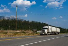 Semi-truck driving on a major U.S. highway representing regional freight transportation
