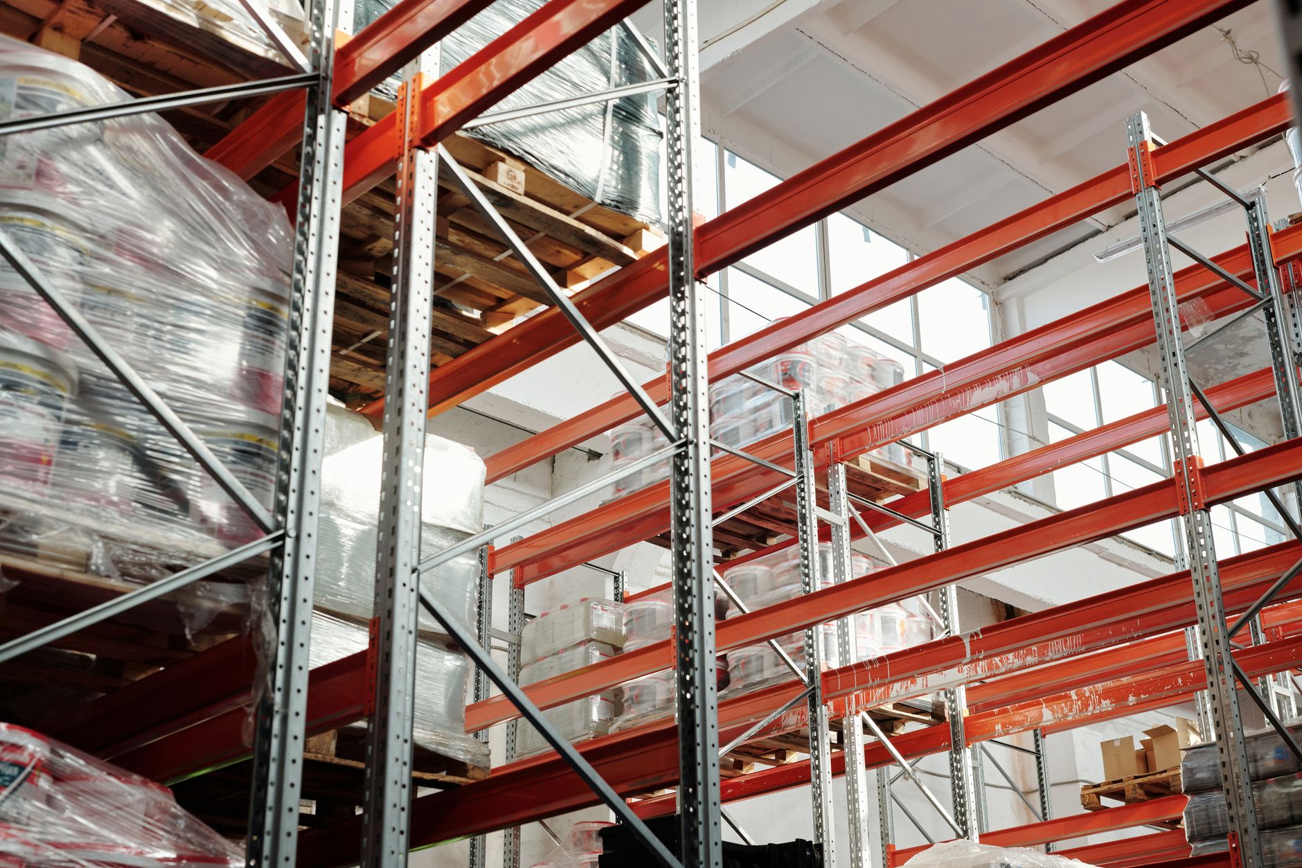 Interior of a large distribution warehouse with shelving and equipment