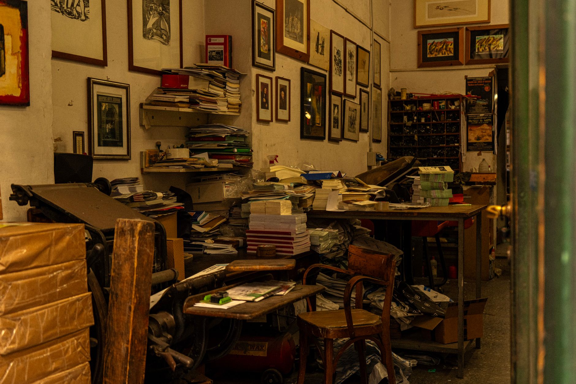 Interior of a commercial printing shop with large format printing equipment