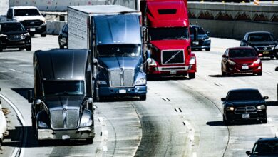 A freight truck driving on an open highway representing regional shipping logistics