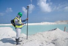 Environmental consultant conducting a field site assessment outdoors