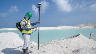 Environmental consultant conducting a field site assessment outdoors