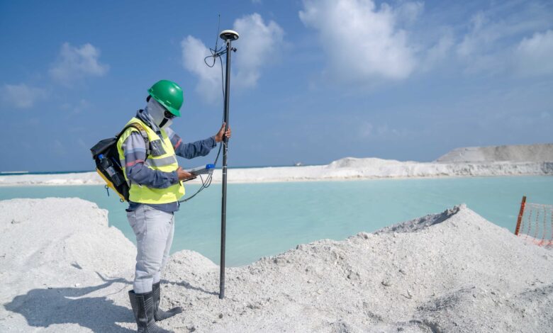 Environmental consultant conducting a field site assessment outdoors