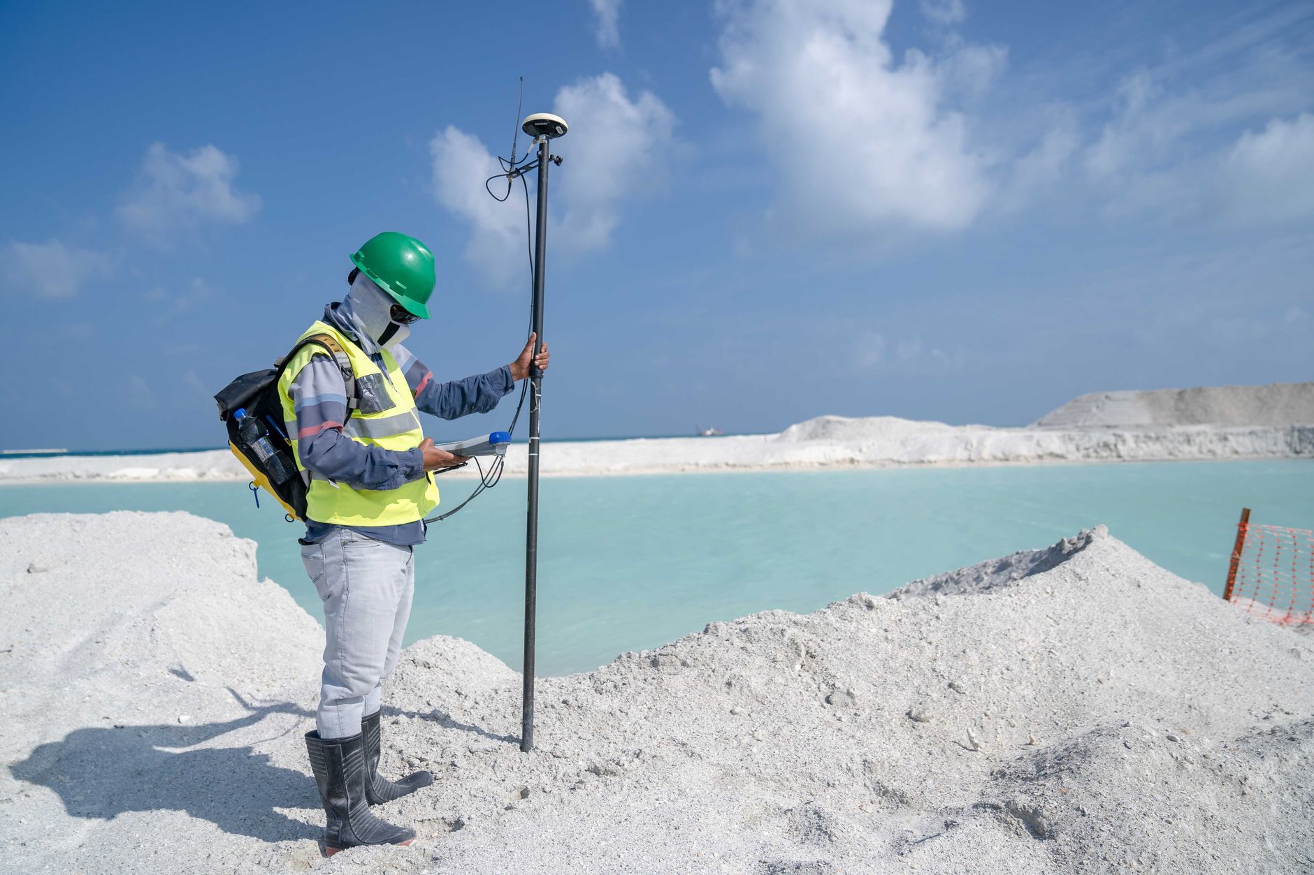 Environmental consultant conducting a field site assessment outdoors