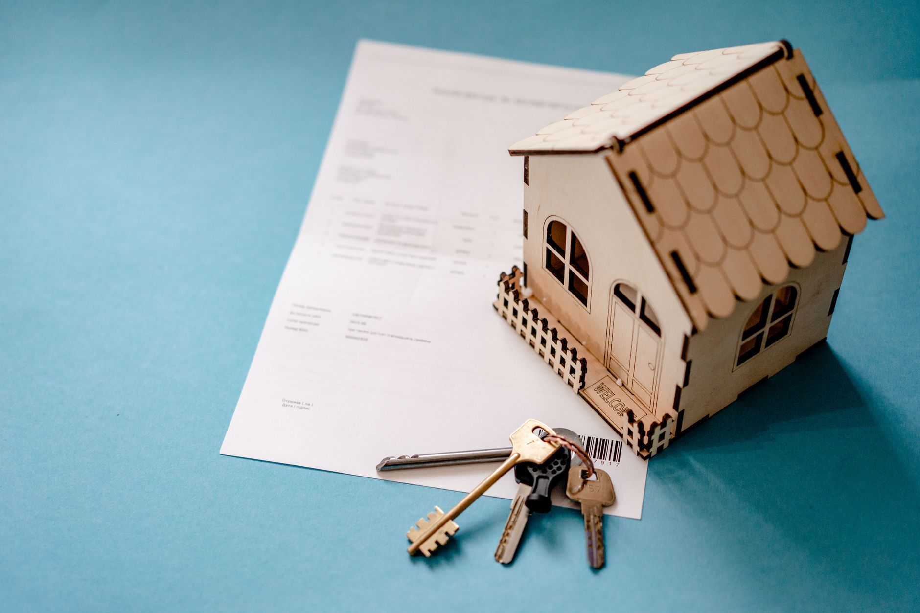 Real estate closing documents and contracts spread across a desk