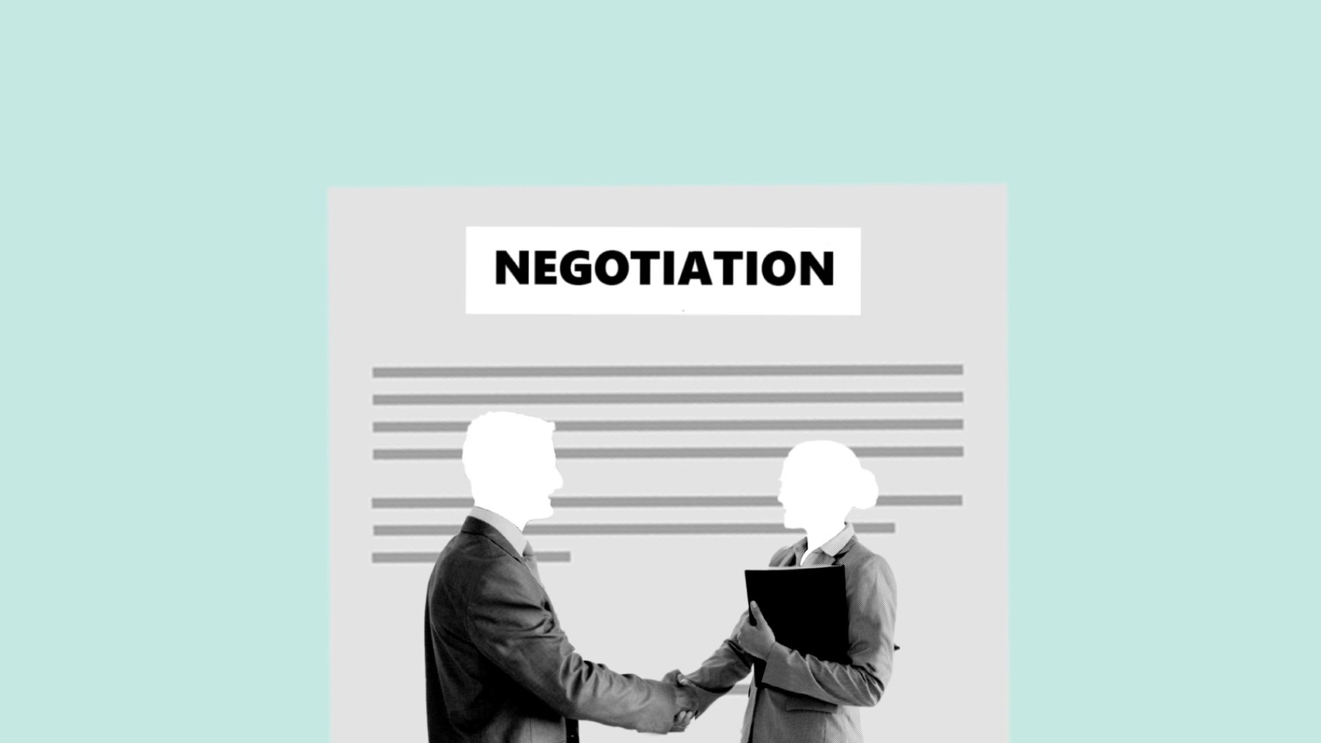 Business professionals shaking hands during a commercial account meeting