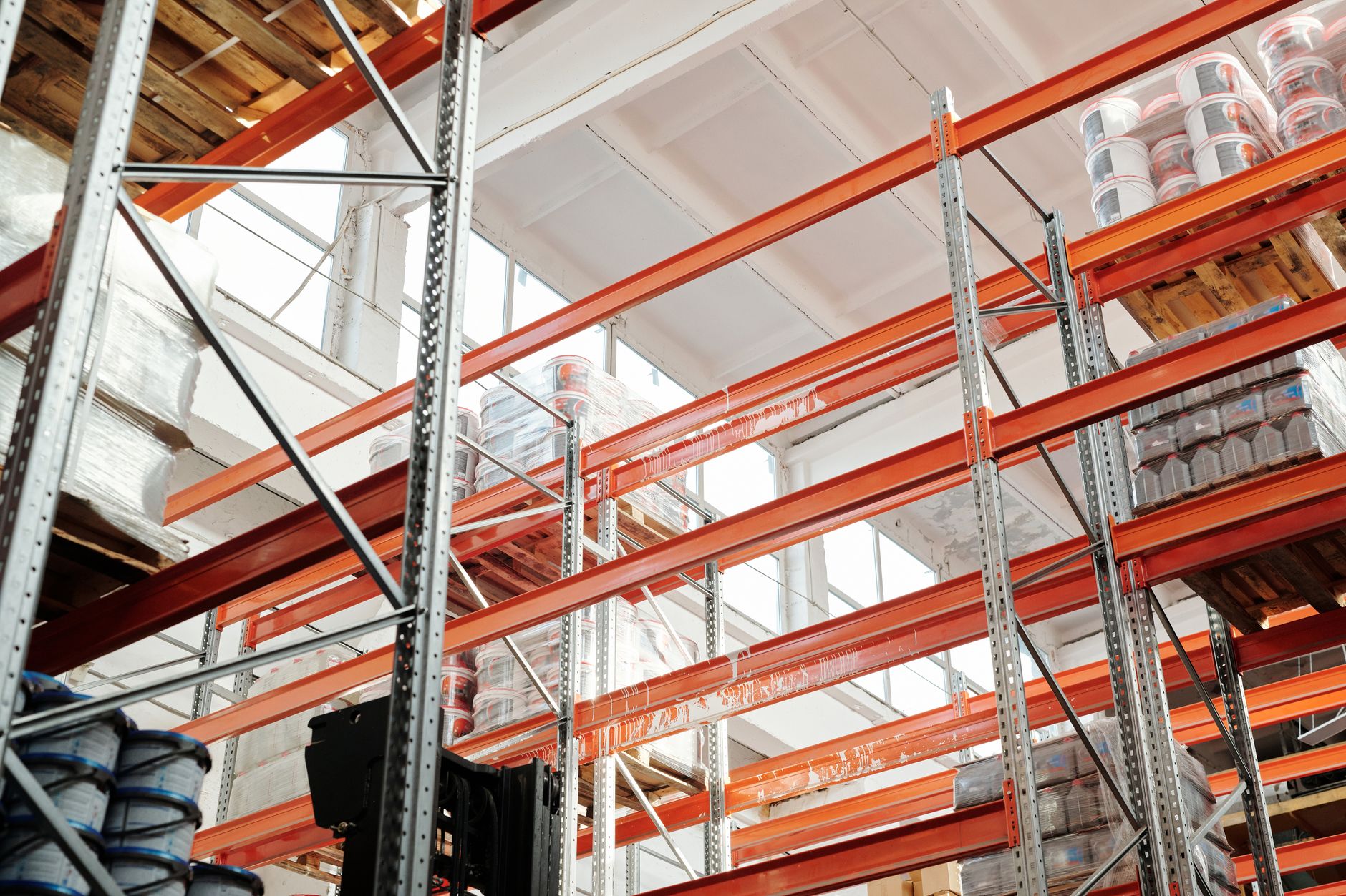 Interior of a busy warehouse with freight pallets staged for shipping