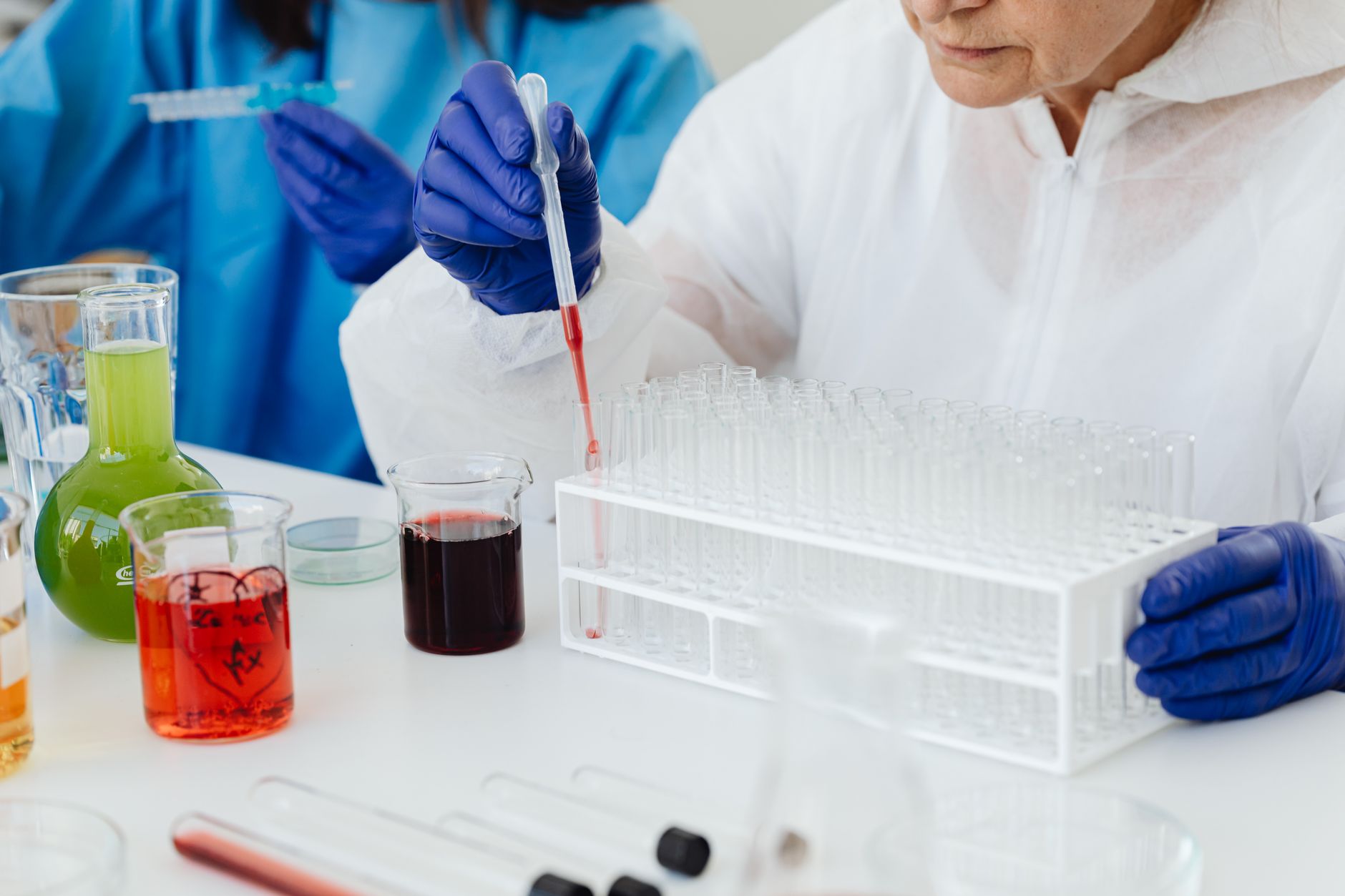 Medical laboratory technician analyzing specimens at a clinical workstation