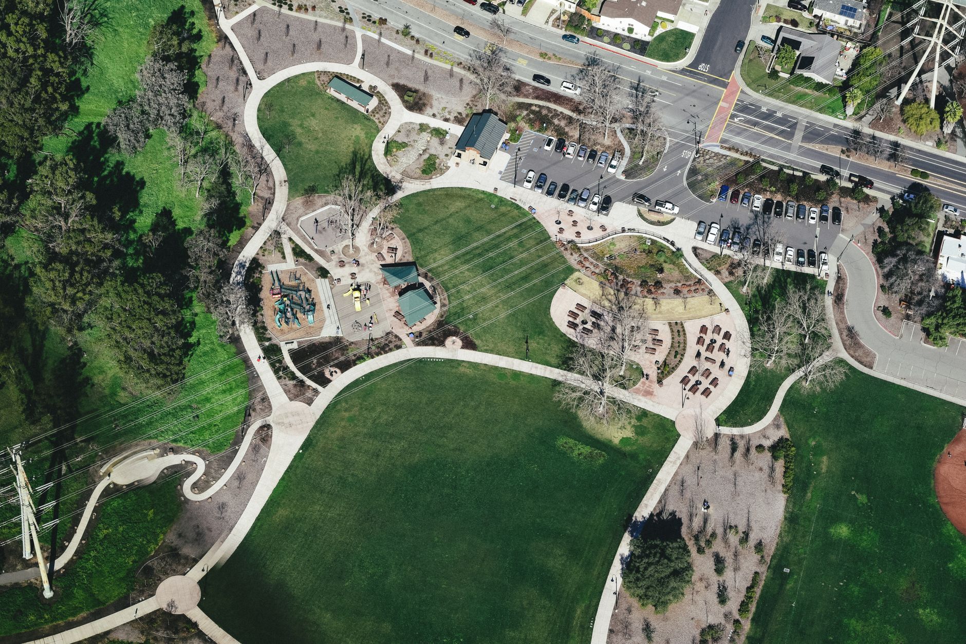 Aerial view of a designed urban green space surrounded by city buildings