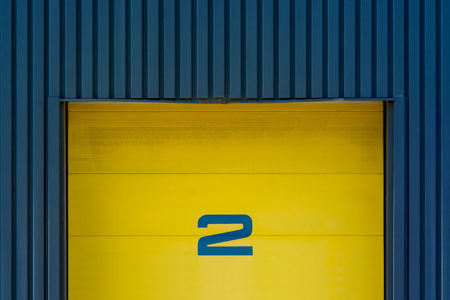 Mid-size manufacturing warehouse representing commercial businesses facing insurance coverage gaps