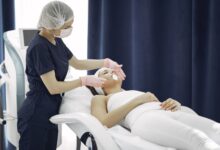 A clean, modern dermatology clinic waiting room with soft lighting and product displays