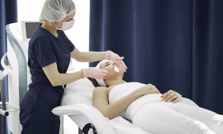 A clean, modern dermatology clinic waiting room with soft lighting and product displays