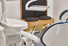 Modern oral surgery office with dental chair and surgical equipment