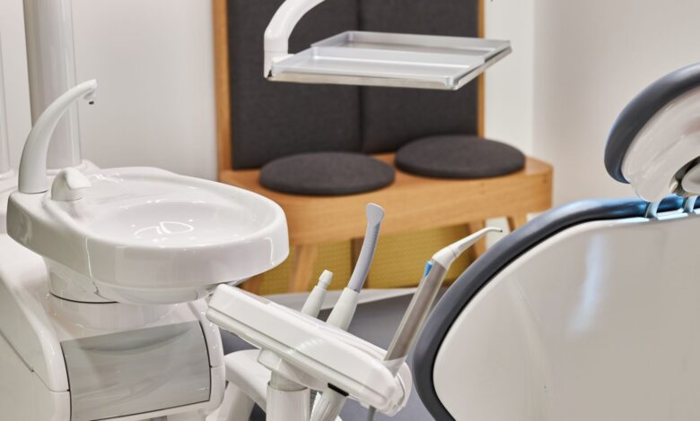 Modern oral surgery office with dental chair and surgical equipment