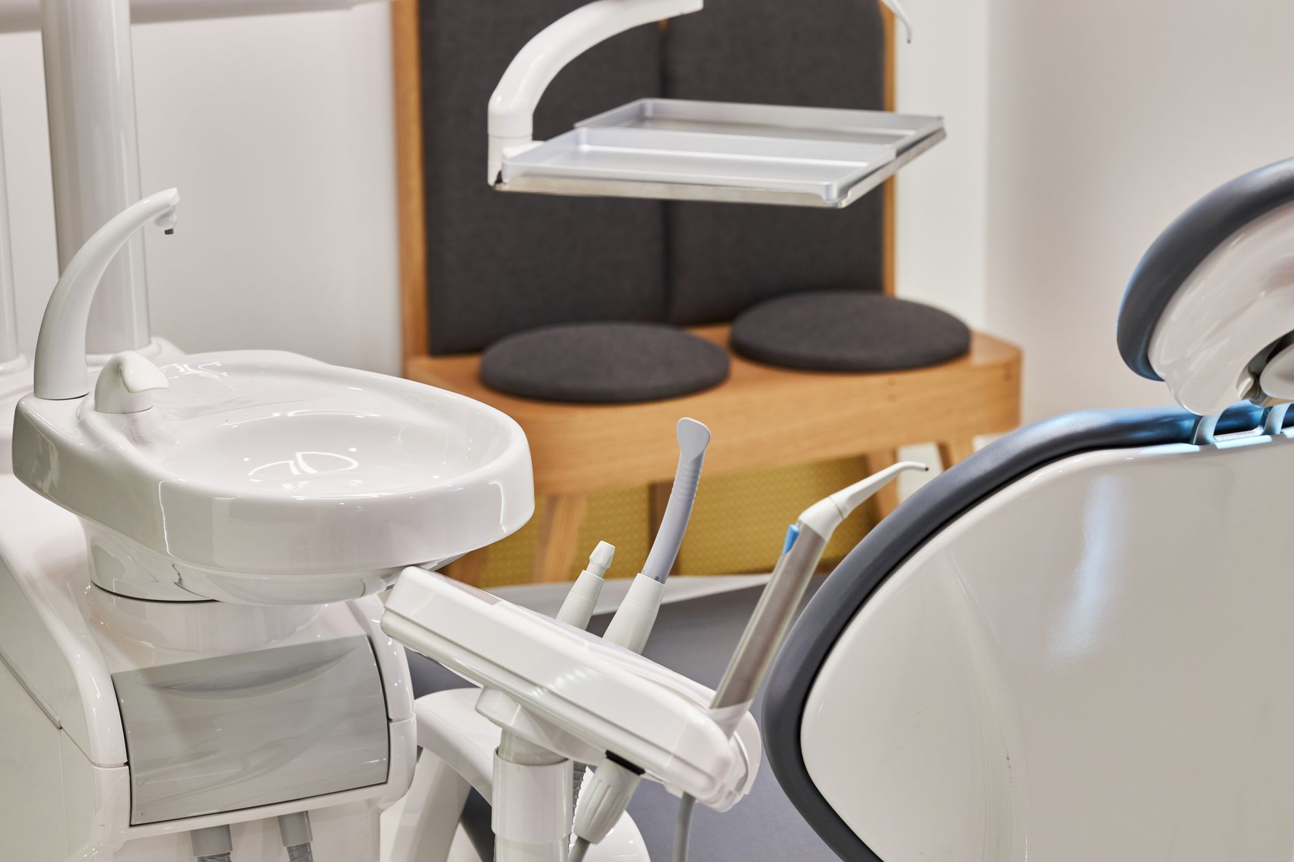 Modern oral surgery office with dental chair and surgical equipment