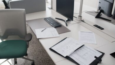 Commercial real estate appraiser reviewing property documents at a desk