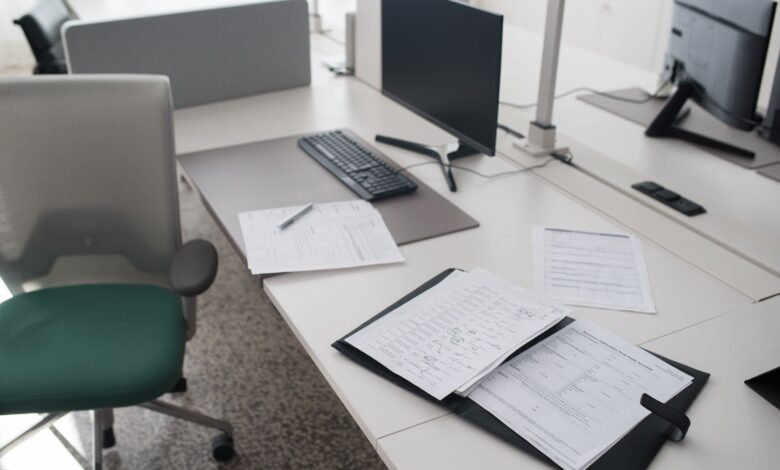 Commercial real estate appraiser reviewing property documents at a desk