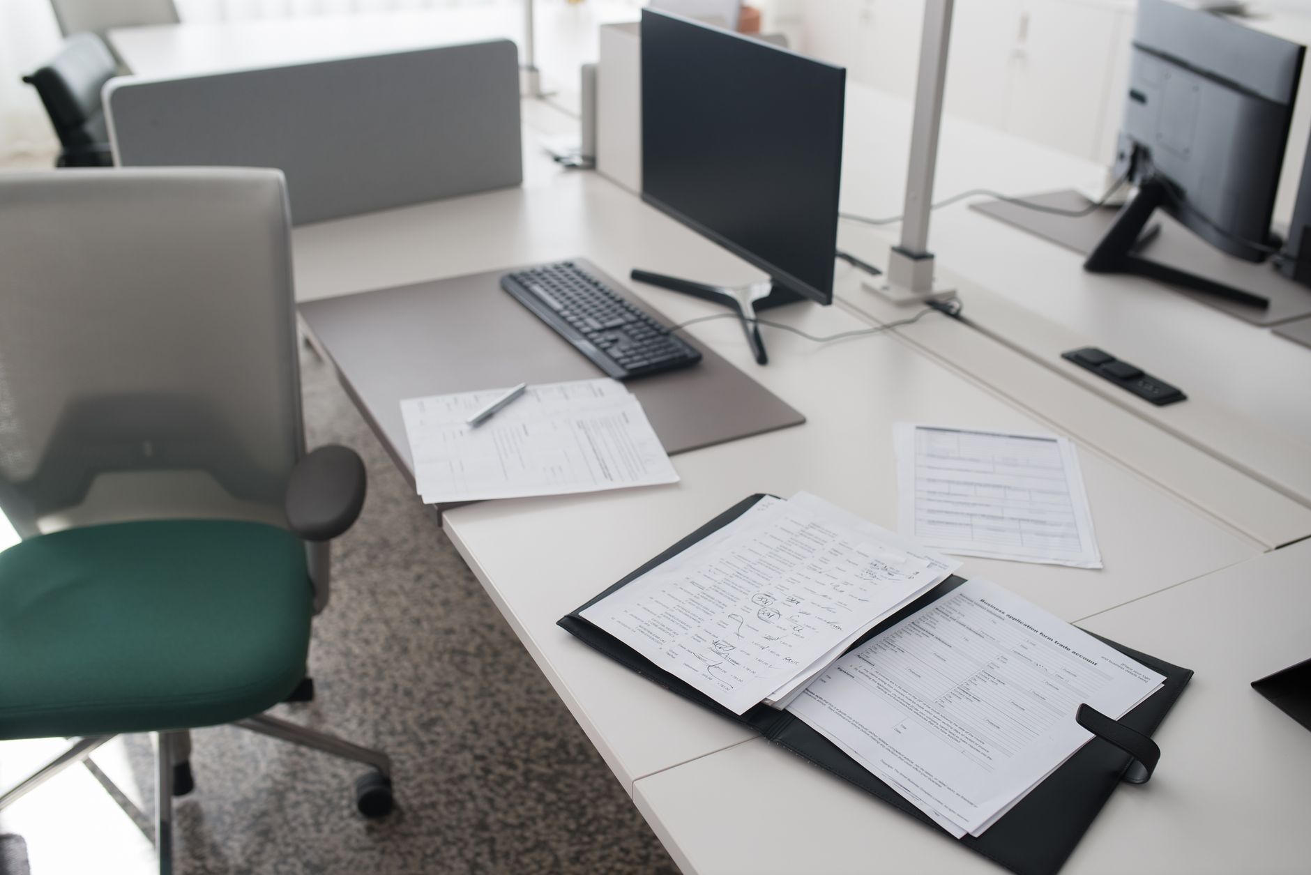 Commercial real estate appraiser reviewing property documents at a desk