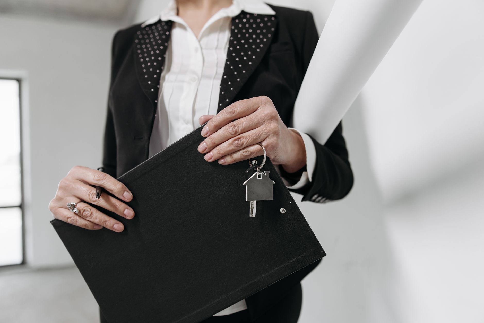 Paperwork and keys on a desk representing a real estate closing transaction