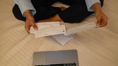 Healthcare billing documents spread across a desk representing hospice contract administration