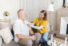 A hospice nurse visiting a patient at home during an end-of-life care appointment