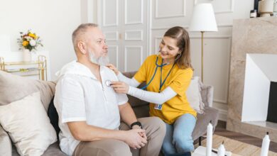 A hospice nurse visiting a patient at home during an end-of-life care appointment