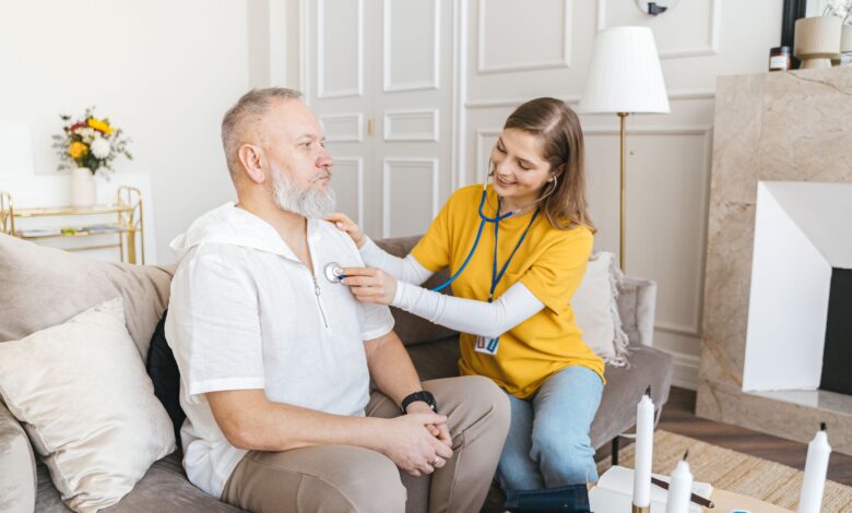 A hospice nurse visiting a patient at home during an end-of-life care appointment