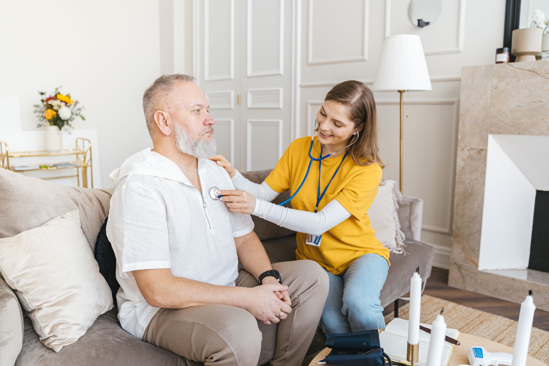 A hospice nurse visiting a patient at home during an end-of-life care appointment