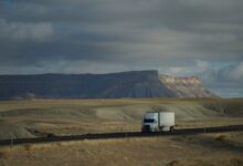 Semi truck driving on an open highway representing freight and trucking industry operations