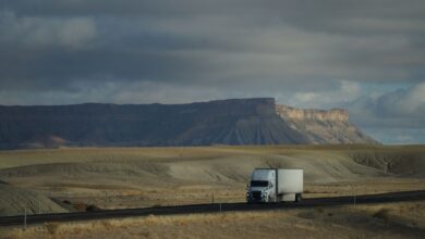 Semi truck driving on an open highway representing freight and trucking industry operations