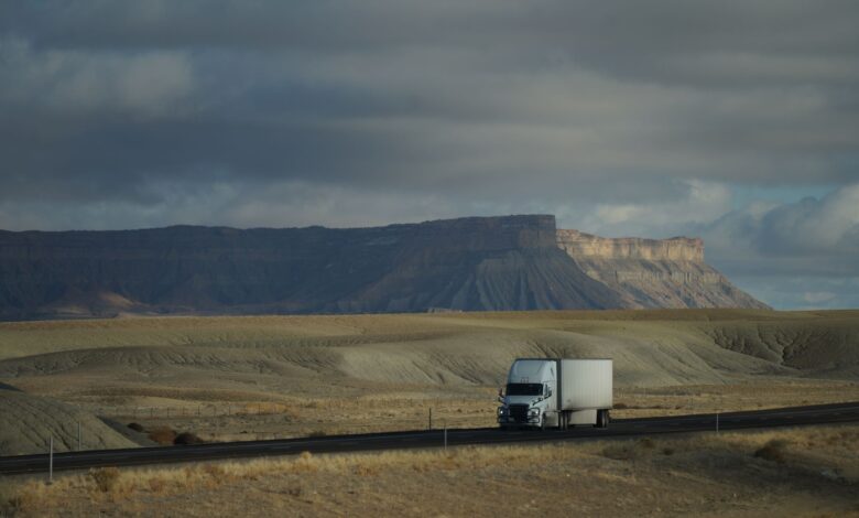 Semi truck driving on an open highway representing freight and trucking industry operations