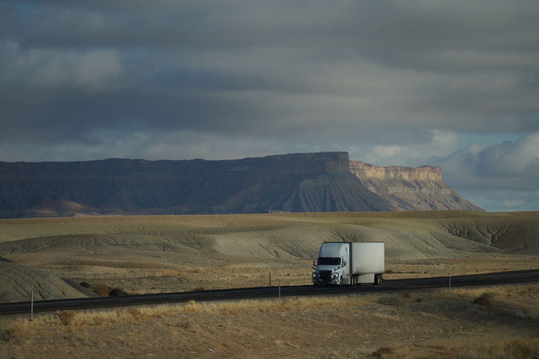 Semi truck driving on an open highway representing freight and trucking industry operations