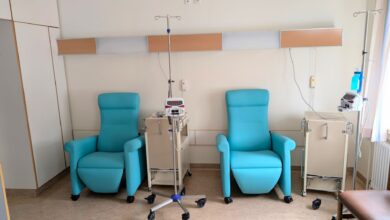 Interior of a clinical occupational therapy practice with treatment tables and equipment
