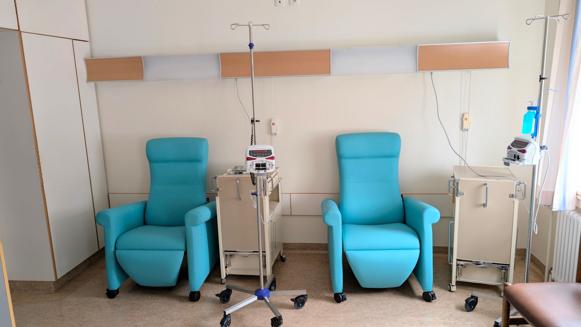 Interior of a clinical occupational therapy practice with treatment tables and equipment