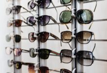 Interior of an optical retail store with eyeglass frames displayed on shelves