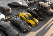 Rows of vehicles lined up at an outdoor auto auction lot
