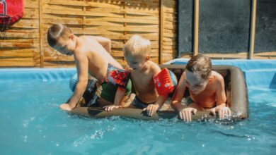 Children taking swimming lessons in an indoor pool at a local swim school