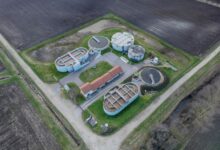 Aerial view of a municipal water treatment facility with filtration tanks