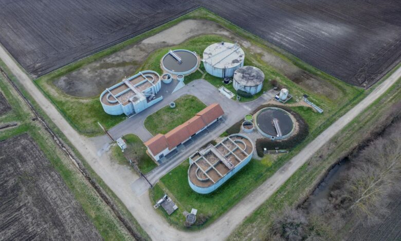 Aerial view of a municipal water treatment facility with filtration tanks
