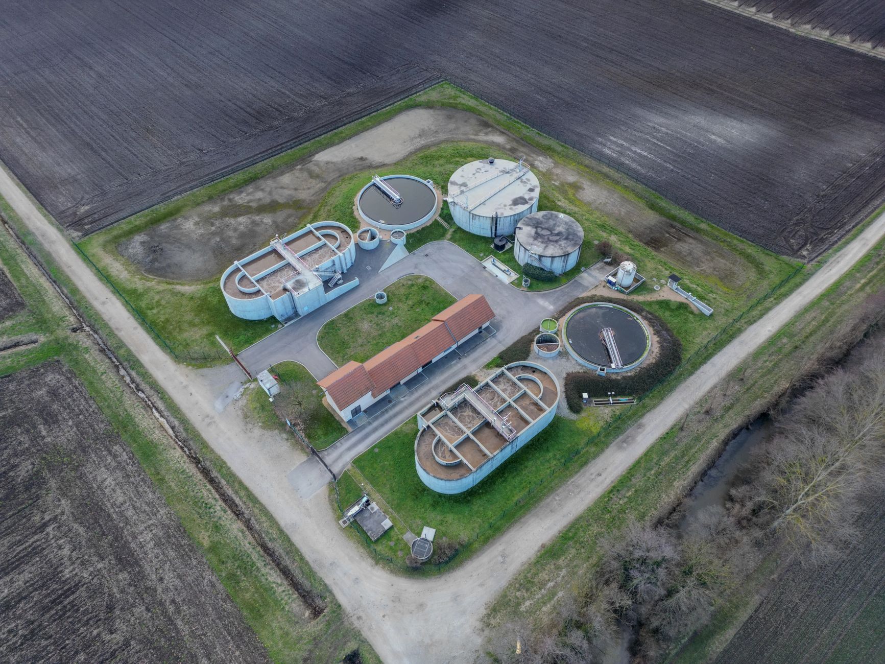 Aerial view of a municipal water treatment facility with filtration tanks