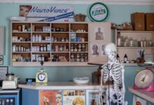 A modern pharmacy interior showing prescription medication shelves and counter