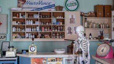 A modern pharmacy interior showing prescription medication shelves and counter