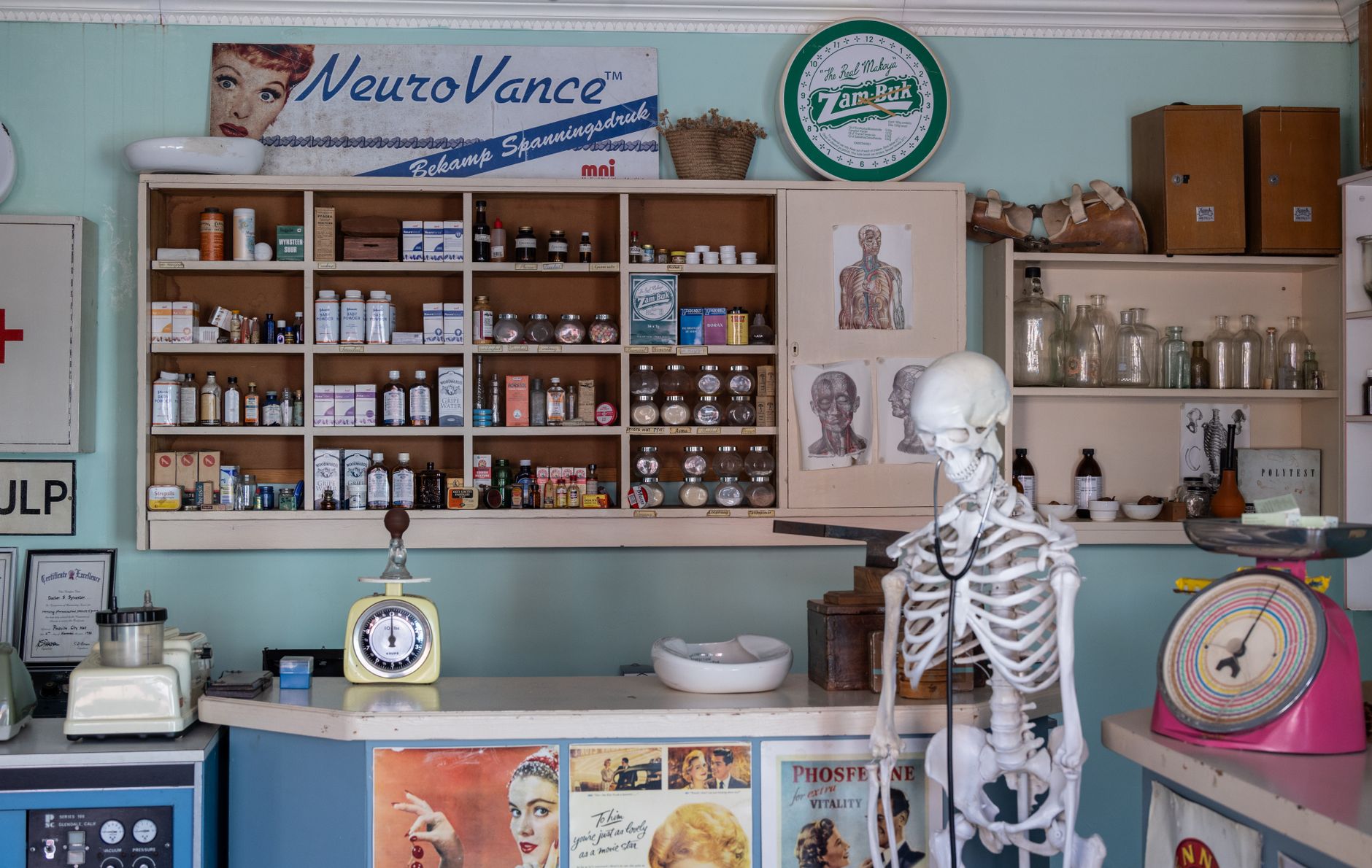 A modern pharmacy interior showing prescription medication shelves and counter
