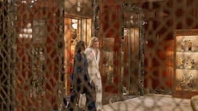 Modern elevator interior with stainless steel doors and control panel