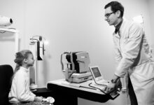 A patient receiving an eye examination at a modern ophthalmology clinic