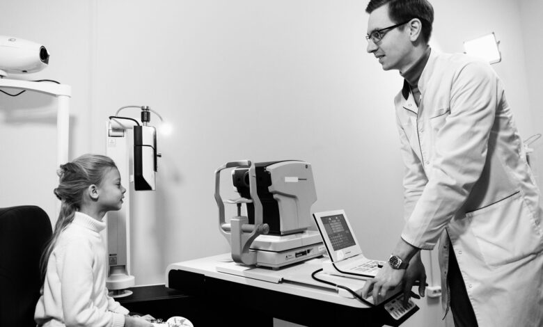 A patient receiving an eye examination at a modern ophthalmology clinic